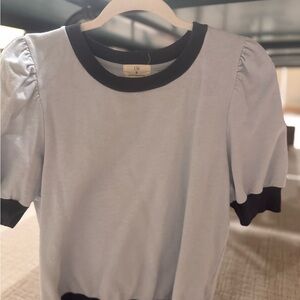 ANTHROPOLOGIE: LIGHT BLUE SHIRT WITH NAVY TRIM.